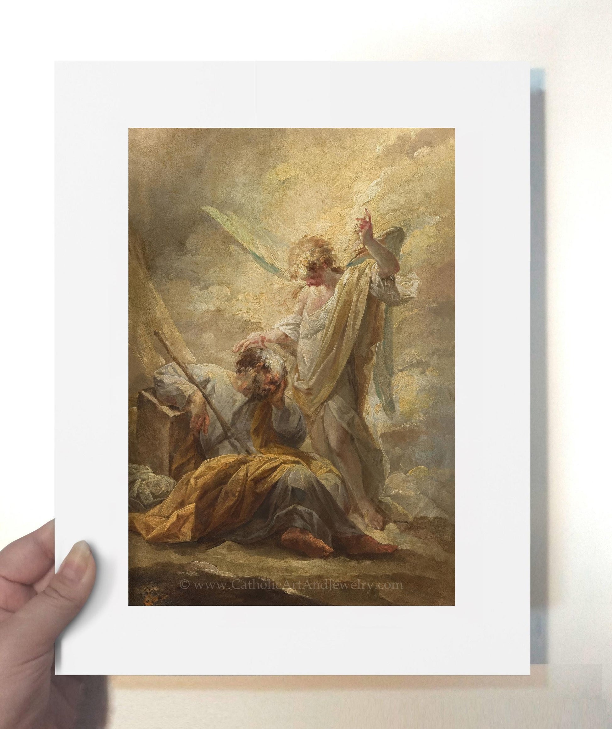 a painting of jesus on the cross being held by a person